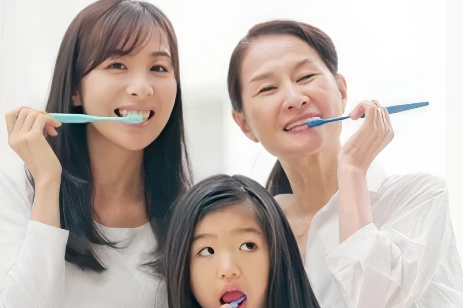 family-brushing-teeth-three-ladies.jpg